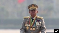 FILE - Gen. Min Aung Hlaing inspects officers during a parade to mark Myanmar's 78th Armed Forces Day in Naypyitaw, Myanmar, March 27, 2023.