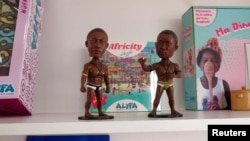 Statues representing Senegalese wrestlers, created by Rocky Daff, are displayed at the headquarters of Alifa Toys in Dakar, Senegal on December 17, 2024.