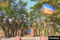 FILE - A photo released by the Arakan Army shows its members posing at one of the Myanmar junta's military posts it captured in Gwa township in Myanmar's southern Rakhine state on December 29, 2024 .